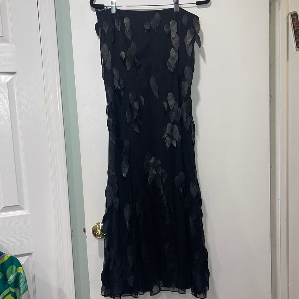 Stunning black maxi skirt with faux cascading leather leaves